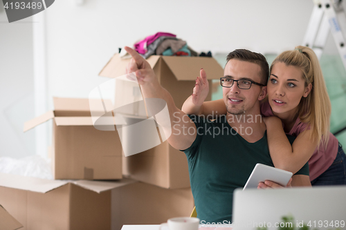 Image of Young couple moving in a new home