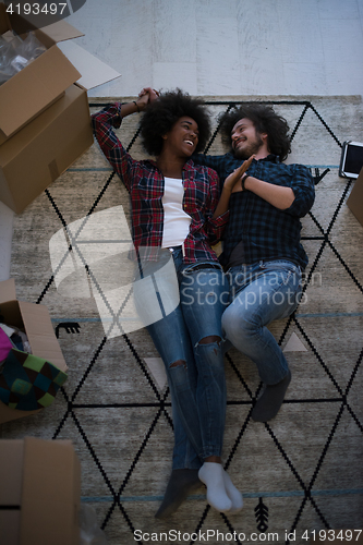 Image of Top view of attractive young multiethnic couple