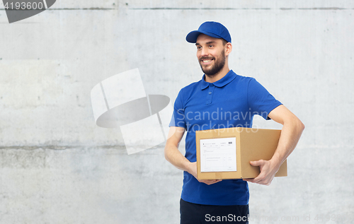 Image of happy delivery man with parcel box