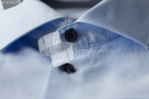 Image of close up of blue shirt collar