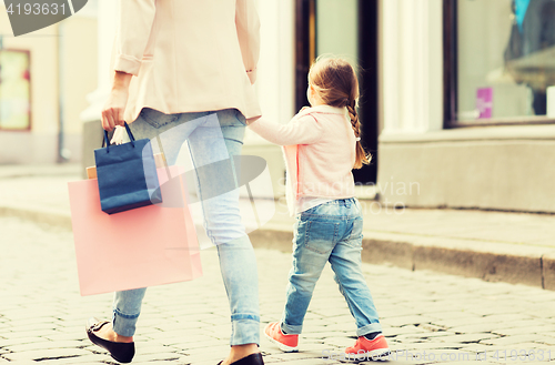 Image of close up of mother and child shopping in city