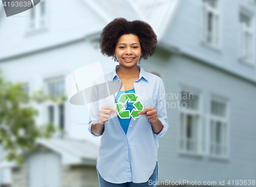 Image of happy afro american woman over house background