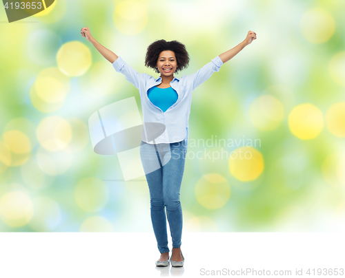 Image of happy african american young woman over white