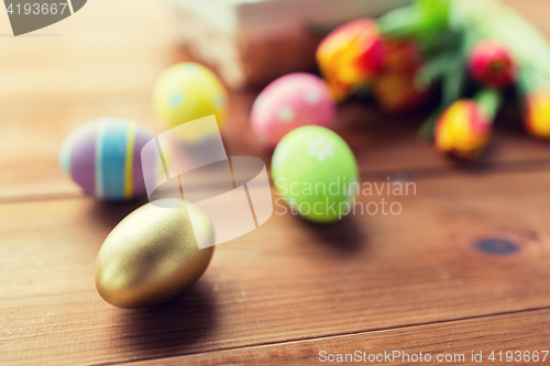 Image of close up of colored easter eggs and flowers