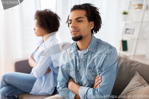 Image of unhappy couple having argument at home