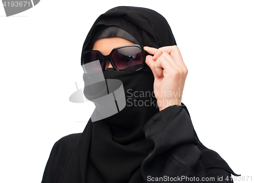 Image of muslim woman in hijab and sunglasses over white