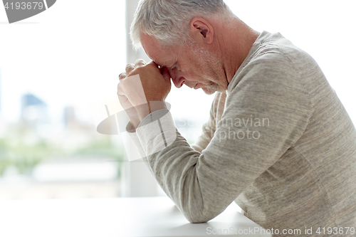 Image of close up of senior man thinking