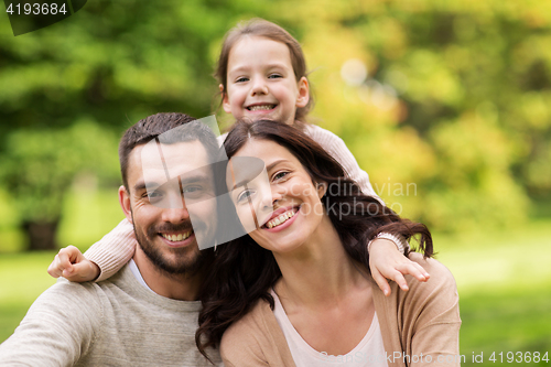 Image of happy family in summer park