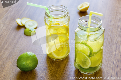Image of A couple of cool cocktails of fresh fruit in jars