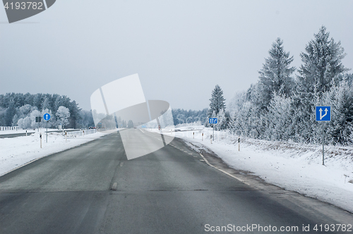 Image of Highway in the winter, the trees covered with hoarfrost