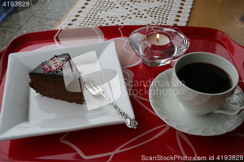 Image of Piece of chocolate cake and coffee