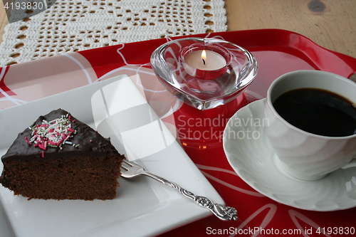 Image of Piece of chocolate cake and coffee