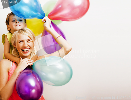 Image of pretty family with color balloons on white background, blond wom