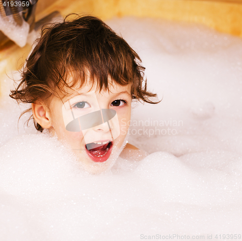 Image of little cute boy in bathroom with bubbles close up, lifestyle real people concept