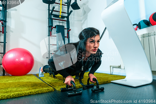 Image of The female athlete doing they exercise in a ems fitness studio