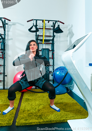 Image of The female athlete doing they exercise in a ems fitness studio