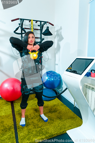 Image of The female athlete doing they exercise in a ems fitness studio