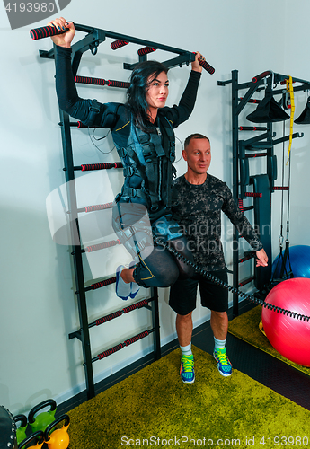 Image of The female athlete doing they exercise in a ems fitness studio