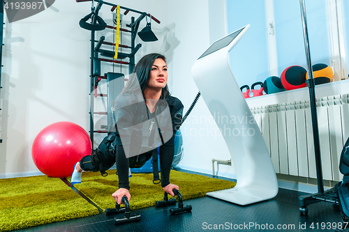 Image of The female athlete doing they exercise in a ems fitness studio