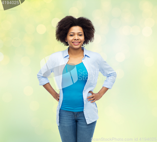 Image of happy african american young woman over white