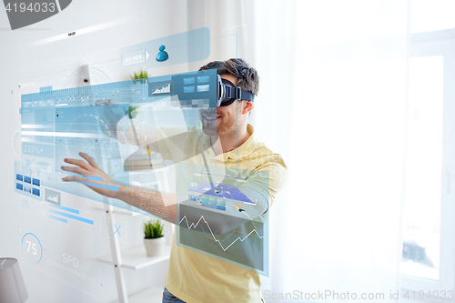 Image of young man in virtual reality headset or 3d glasses