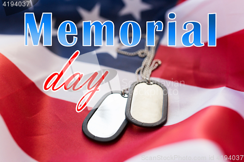 Image of memorial day words over american flag and dog tags