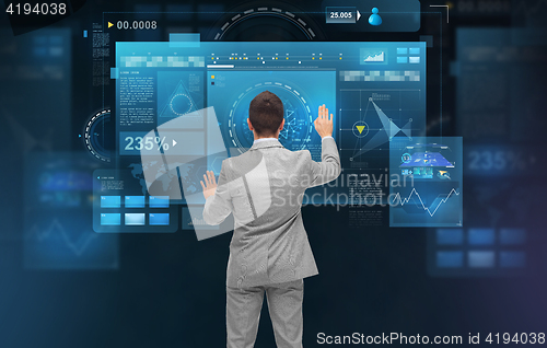 Image of businessman working with virtual screens