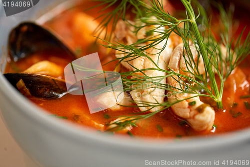 Image of close up of seafood soup with fish and mussels