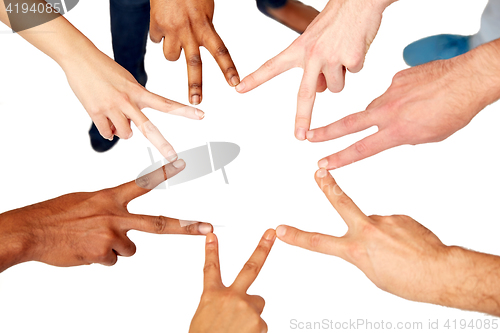 Image of group of international people showing peace sign