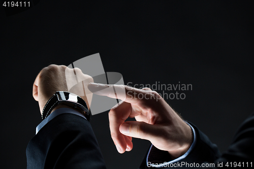 Image of close up of businessman hands with smart watch