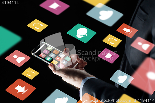 Image of close up of businessman hand with glass smartphone