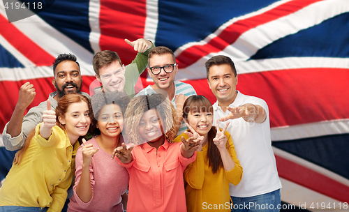 Image of international people gesturing over british flag