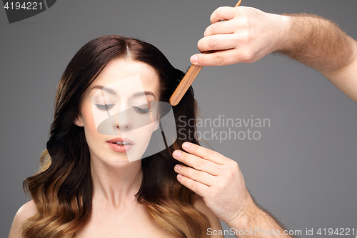 Image of A beautiful woman in the hairdresser 