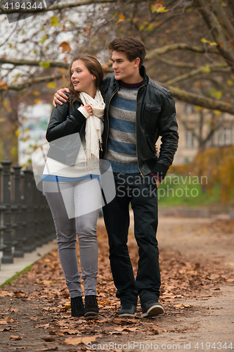 Image of Happy young Couple in Autumn Park
