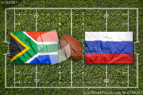 Image of South Africa vs. Russia flags on rugby field