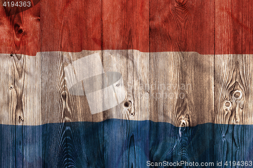 Image of National flag of Netherlands, wooden background