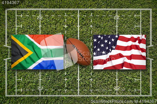 Image of South Africa vs. USA flags on rugby field
