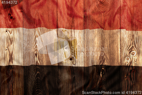 Image of National flag of Egypt, wooden background