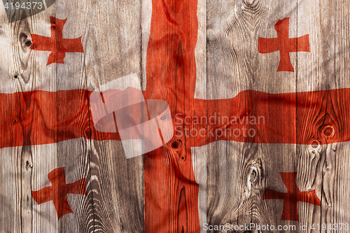 Image of National flag of Georgia, wooden background