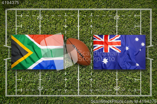 Image of South Africa vs. Australia flags on rugby field