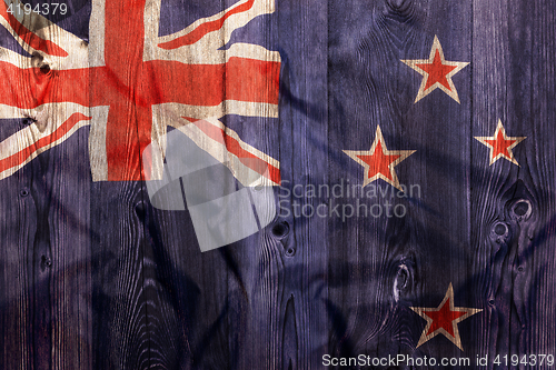 Image of National flag of New Zealand, wooden background