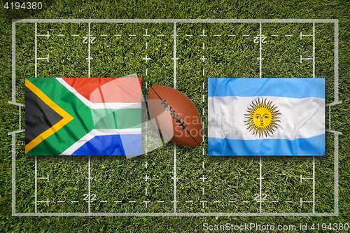 Image of South Africa vs. Argentina flags on rugby field