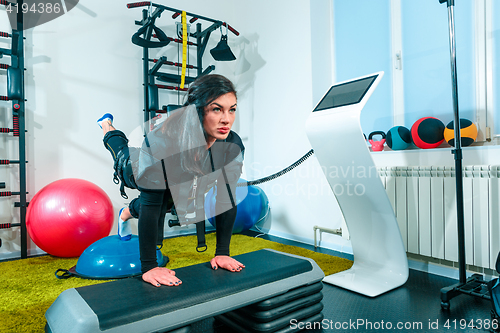 Image of The female athlete doing they exercise in a ems fitness studio