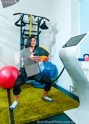 Image of The female athlete doing they exercise in a ems fitness studio