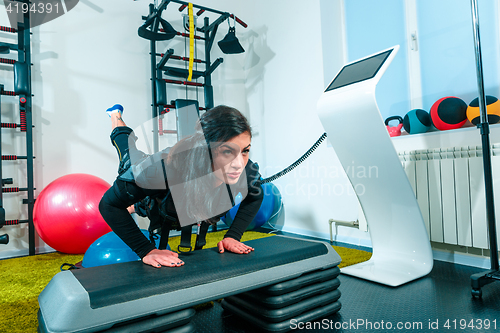 Image of The female athlete doing they exercise in a ems fitness studio