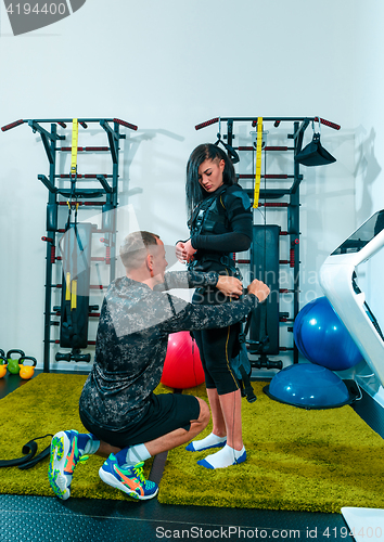 Image of The female athlete doing they exercise in a ems fitness studio