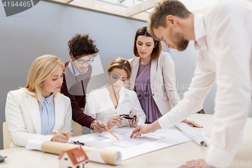 Image of business team discussing house project at office