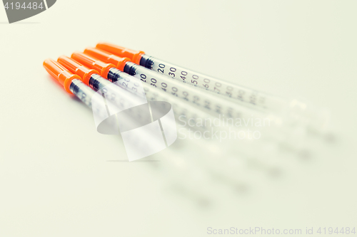 Image of close up of insulin syringes on table