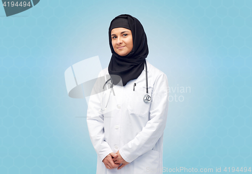 Image of muslim female doctor in hijab with stethoscope
