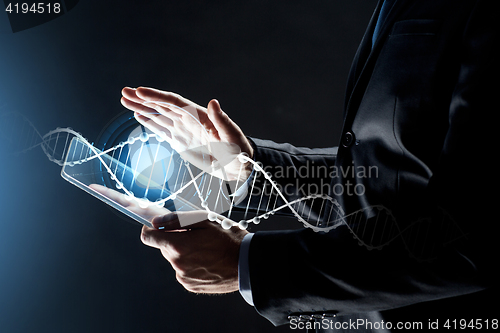 Image of close up of businessman with transparent tablet pc